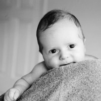 baby boy on mothers shoulder